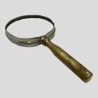Vintage magnifer handheld glass with silver plated frame and handle display