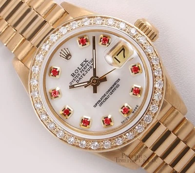 Rolex Lady Datejust 26 mm President 18 quilates YG bisel de diamantes blanco esfera rubí sin trapear Foto 1 de 4