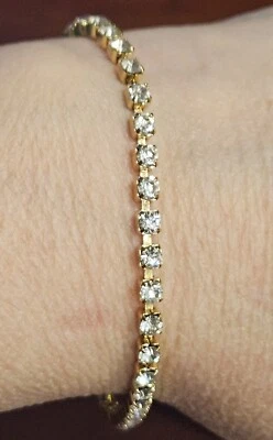 VTG Brilliant Crystal Tennis Bracelet Gold Tone Jewelry Fold Over Clasp 7-8"L - Image 1 of 4