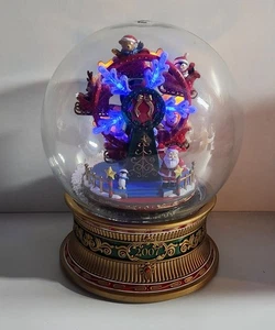 Globo de nieve musical Avon Christmas Light Up Noria 2007, funcionando  - Imagen 1 de 9