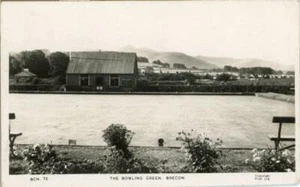 REAL PHOTO POSTCARD OF THE BOWLING GREEN, BRECON, BRECKNOCKSHIRE, WALES BY FRITH - Picture 1 of 2