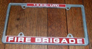 VINTAGE 1989 UTC UNITED TECHNOLOGIES FIRE BRIGADE LICENSE PLATE TOPPER - Picture 1 of 1