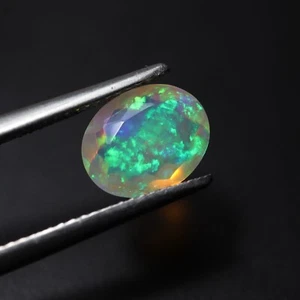 8x10 MM Oval Cut 1.5 Ct Natural AAA Rainbow Fire Faceted Ethiopian Opal Gemstone - Imagen 1 de 10