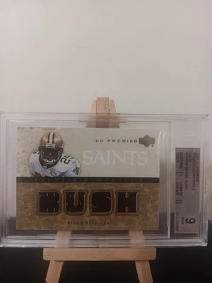 Reggie Bush UD premier quadruple patch 4 remnants Beckett 9 - Image 1 of 4