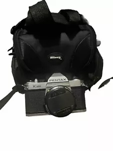 Fotocamera vintage Asahi Pentax K1000 nuova di zecca con obiettivo 50 mm 1:2 pellicola funzionante con borsa - Foto 1 di 5
