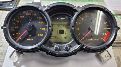 OEM SUZUKI 650 VSTROM GAUGE CLUSTER 2004-2006 34120-27G11 *ONE TAB BROKEN* - Image 1 of 4