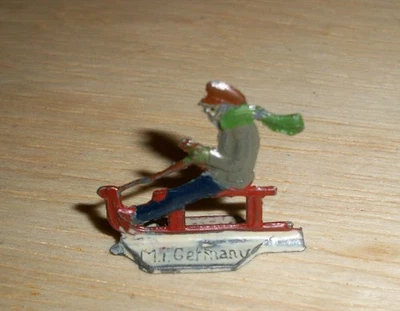 Heinrichsen flat lead winter figure on sled made in Germany - Image 1 of 2