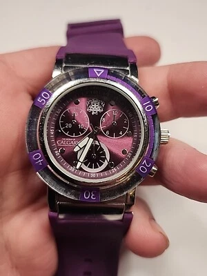Reloj World Of Calgary púrpura 102779354-Q correa de goma como está - Imagen 1 de 4