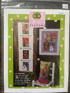 Amy Bruecken Diseños Temporadas Verano Invierno Otoño Primavera 4 Patrones Punto de Cruz - Imagen 1 de 2