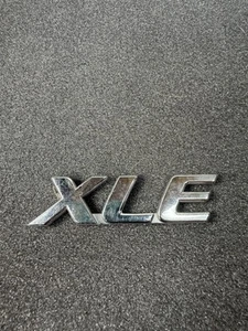 OEM Toyota Sienna (1998-2020) XLE Rear Emblem Chrome 75443-08030 - Picture 1 of 6