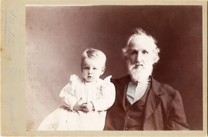 PORTRAIT OF A BEFUDDLED GRANDFATHER AND YOUNG GRANDCHILD IN JAMESTOWN         - Picture 1 of 3