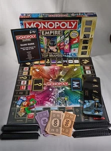 Monopoly Empire Gioco da Tavolo Gold Edition Own The World's Top Brands 100% Completo - Foto 1 di 15