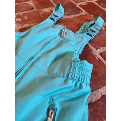 Pantalones de esquí Champion Kids verde azulado con babero de nieve aislados talla M 7-8 Venture Dry Foto 1 de 4