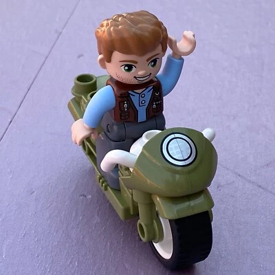 LEGO DUPLO  Jurassic World Male Owen Figure 2 1/2” With Motorcycle - Image 1 of 4