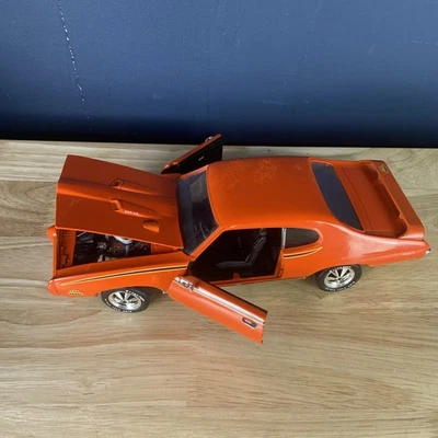 ERTL - AMERICAN MUSCLE - 1969 PONTIAC GTO - EL JUEZ 1/18 DIECAST PINTURA DAÑADA Foto 1 de 4