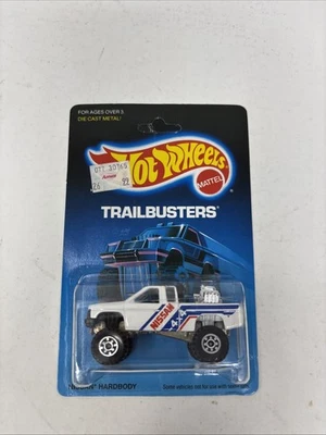Hot Wheels Trailbusters Nissan 1986 carrocería dura ruedas CT 4392 tarjeta sin perforar Foto 1 de 4