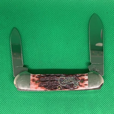 200-2009 Case XX Silver Script Cranberry Jigged Bone 3.625" Canoe 62131 SS - Image 1 of 4