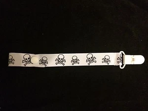 CLIP SOPORTE CALAVERAS CON CHASQUIDO O CUERDA BLANCO - Imagen 1 de 3