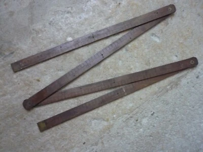 Ancien double mètre pliant à 4 éléments en bois et laiton. - Photo 1/4
