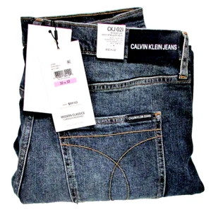 Calvin Klein Mens Denim Blue Jeans Mid Rise Slim 32x32 NWT Light Distress No Hem - Picture 1 of 8