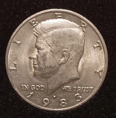 1983 P 50 Kennedy Half  With Extensive Field Restricted Strike Through - Image 1 of 2