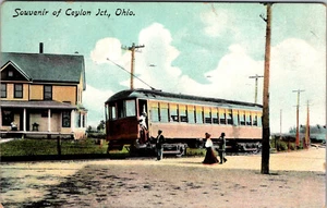 SOUVENIR OF CEYLON JUNCTION, OHIO - LAKE SHORE ELECTRIC TRAM AT HOUSE - POSTCARD - Picture 1 of 2