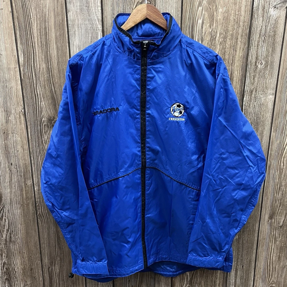 Chaqueta cortavientos vintage Creighton Bluejays fútbol cremallera azul para hombre mediana Foto 1 de 4