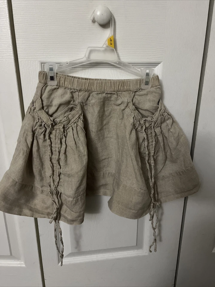 Linda falda gris con volantes y dos bolsillos con alas de papel para niña talla 8 Foto 1 de 4