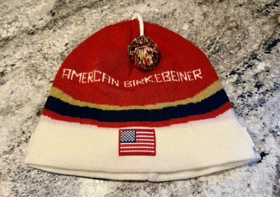 Boné de esqui Swix Seeley clássico americano Birkebeiner Birkie vermelho, azul e dourado, - Imagem 1 de 3