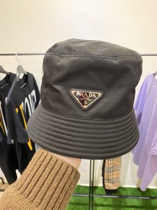 prada bucket hat and bolsa