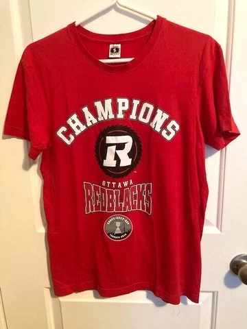 A Piece of History, Autographed Ottawa Redblacks 2016 Grey Cup Champions T-shirt Cover