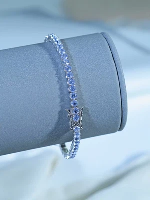 Brazalete de tenis de corte redondo de tanzanita enchapado en oro blanco de 14K de plata de ley 925 Foto 1 de 4