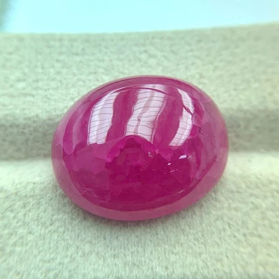 LAB CREATED 34CT BURMESE PINK RUBY CHATHUM INCLUSION OVAL CABOCHON GEMSTONE - Image 1 of 3