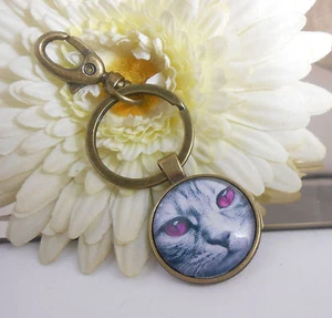 Schlüsselanhänger Taschenbaumler Katze Augen Pink Glas Cabochon 25 mm - Bild 1 von 3