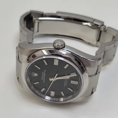 Rolex Oyster Perpetual 36 mm esfera negra Rehaut reloj de acero serie mixta 116000 Foto 1 de 4