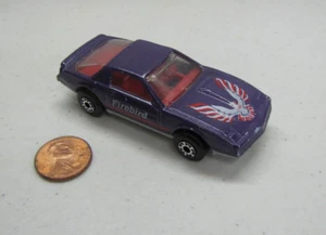 Coche fundido a presión Matchbox Pontiac Firebird Se - púrpura 1982 1:64 - Imagen 1 de 6