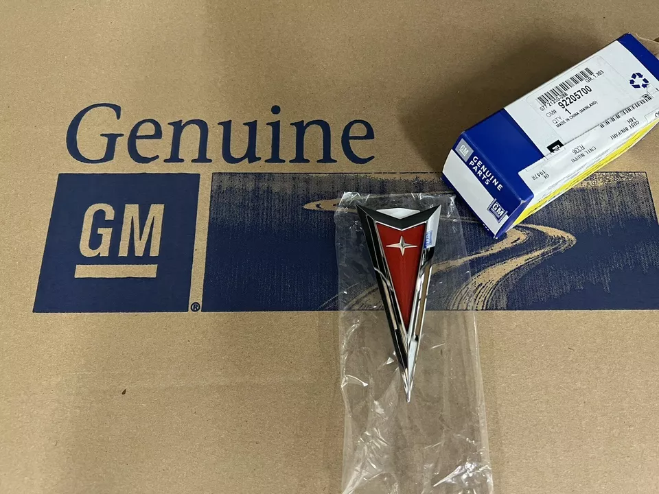 NEW OEM / GM 2008-2009 PONTIAC G8 FRONT CHROME / RED EMBLEM PART # 92205700 - Image 1 of 1