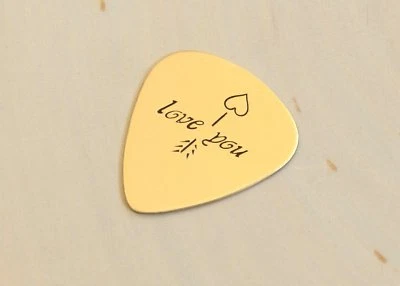 Selección de guitarra Bronze Love con flecha y corazón Foto 1 de 4