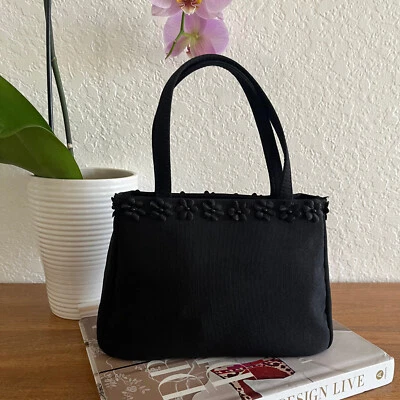 Mini bolso de mano de algodón con apliques florales negros de doble asa Foto 1 de 4