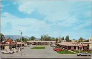 Postal vintage de LOGAN, Utah BAUGH MOTEL Street View autos de los años 60/cromo sin usar - Imagen 1 de 2