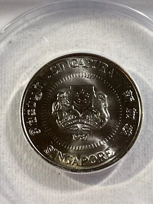 1987 Singapore 50 Cents Graded MS 67 by ANACS - Image 1 of 4