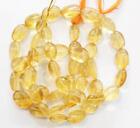 12'' STRAND NATURAL CITRINE BEADS OVAL 8X10 - 10X14.5 MM D10059