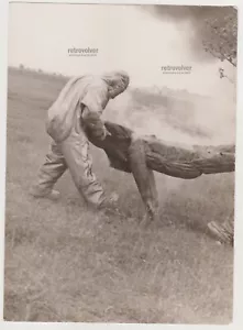 Surreal Sci-Fi Scene Mysterious Rescuers Emerge from Smoke Carry Burnt Man Photo - Picture 1 of 7