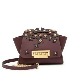 $325 BOLSO BANDOLERA MINI CUERO TACHONADO ZAC POSEN EARTHA VINO NUEVO CON ETIQUETAS - Imagen 1 de 6
