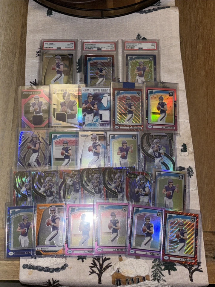 Lote de tarjetas de novato J.J. McCARTHY 2024. 26 tarjetas Prizms, óptica, parches, numeradas Foto 1 de 4
