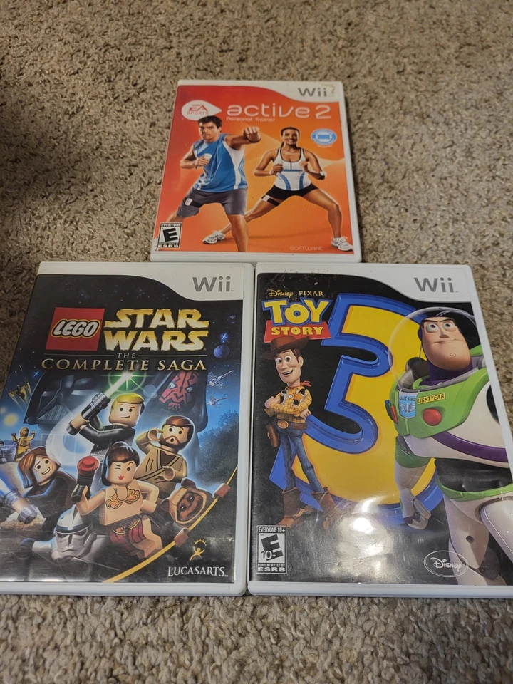 Lote De 3 Juegos Wii Lego Star Wars, Toy Story 3, Ea Sports Active 2 Foto 1 de 4