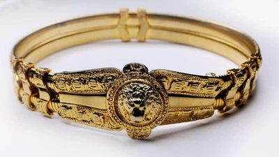 Cinturón elástico Judith Leiber vintage de metal dorado con hebilla de león de la década de 1980 Foto 1 de 4