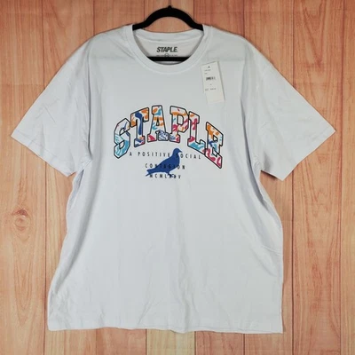 Camiseta Staple Pigeon Para Hombres 2XL Blanca Gráfica Un Contagio Social Positivo MCMLXXV Foto 1 de 4