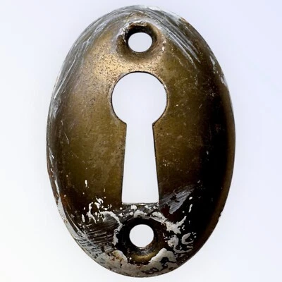 "Antigua cubierta de agujero de llave esqueleto escudo hierro convexo ovalado 1 3/4"" X 1 3/16""" Foto 1 de 3