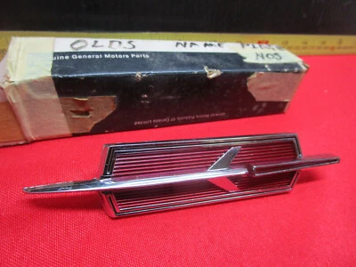 1965 OLDSMOBILE 88 98 DYNAMIC HOOD EMBLEM NOS  - Image 1 of 4